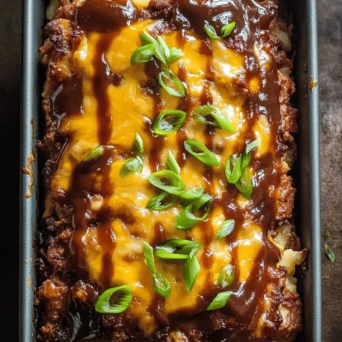 The Ultimate Loaded Potato Meatloaf is a comforting and hearty dish that brings together the best of two worlds—classic meatloaf and creamy, delicious mashed potatoes. This innovative recipe is perfect for family dinners, gatherings, or even meal prep for the week ahead. It combines the rich flavors of ground beef, savory bacon, and melted cheddar cheese, resulting in a meal that is not only satisfying but also incredibly versatile. Whether served as a main course alongside your favorite vegetables or sliced into sandwiches for lunch the next day, this meatloaf is sure to become a staple in your kitchen.